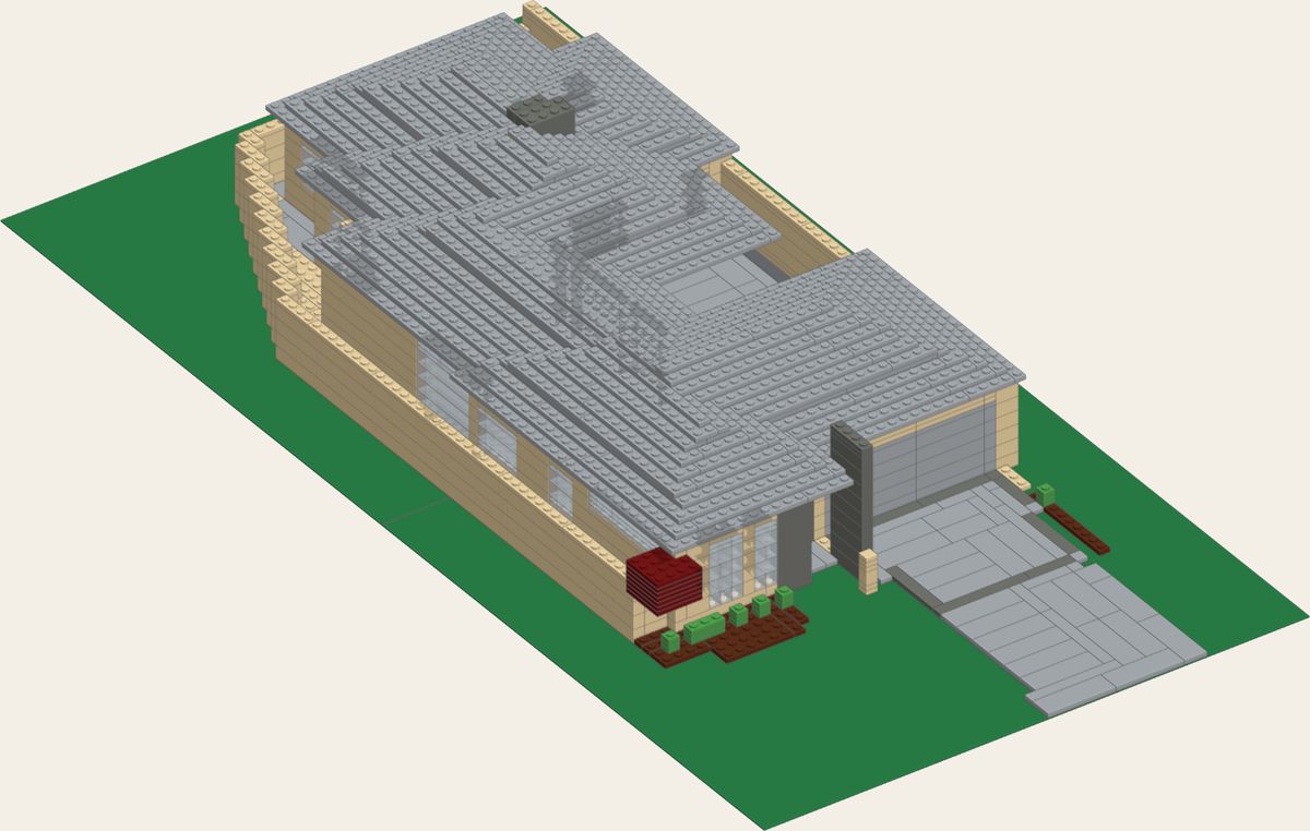 The house as a brick model on green baseplates, with a grey stepped roof.