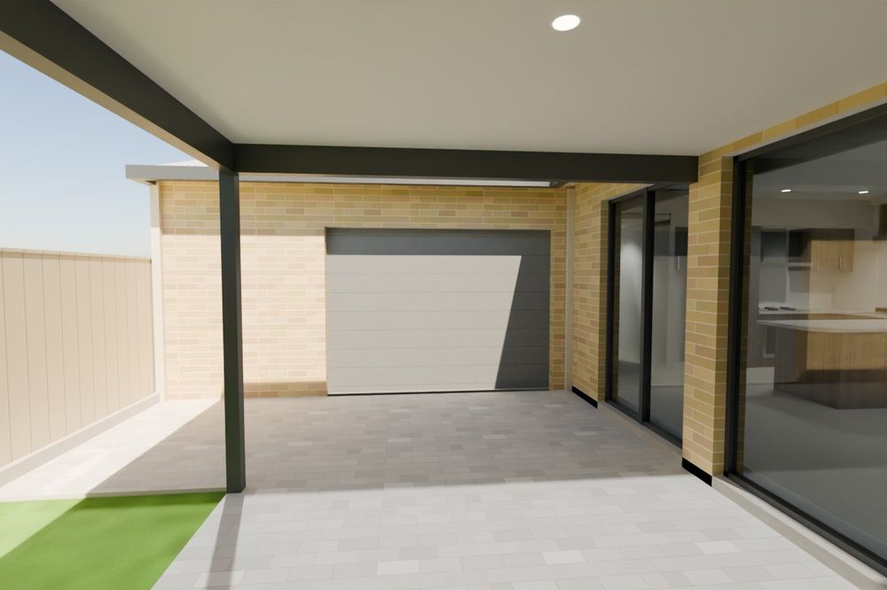 The covered alfresco with the rear garage door and sliding doors.